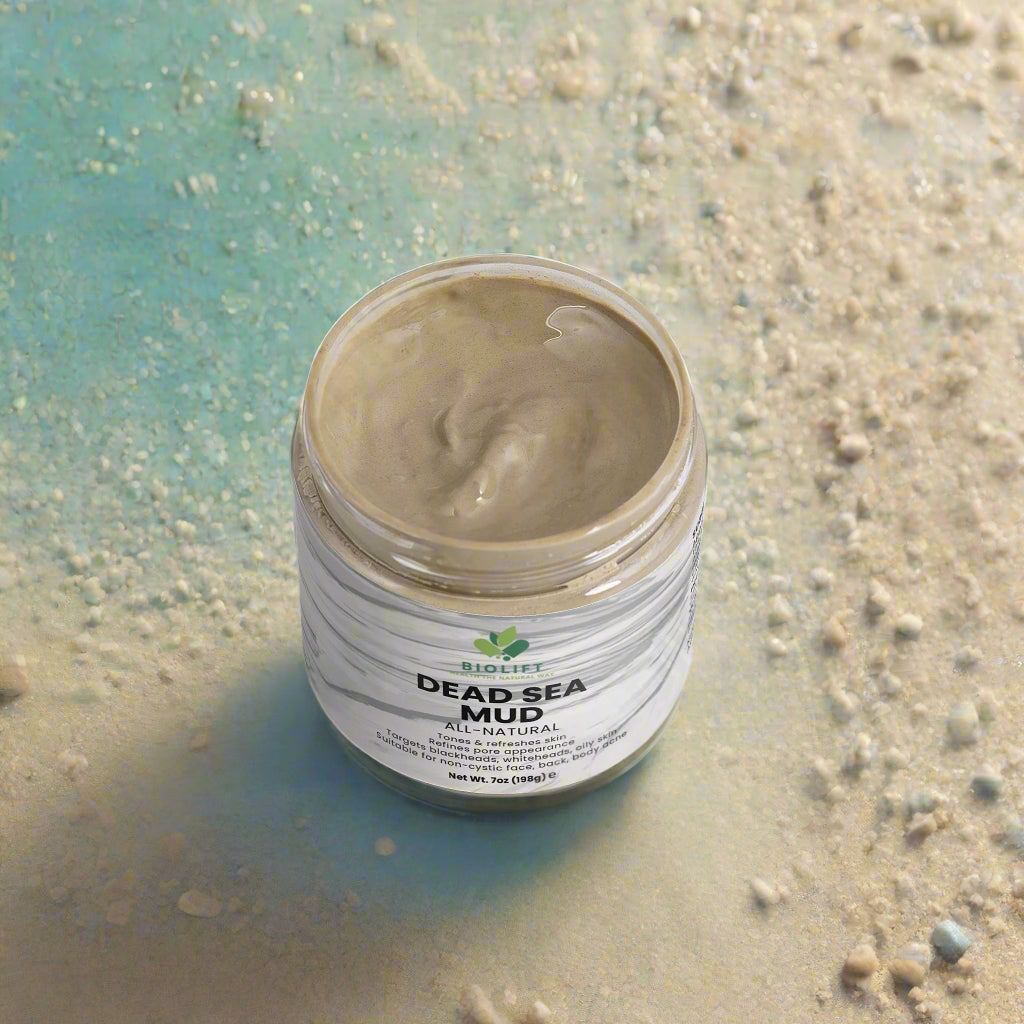 Jar of Dead Sea mud with visible brand label on a white background