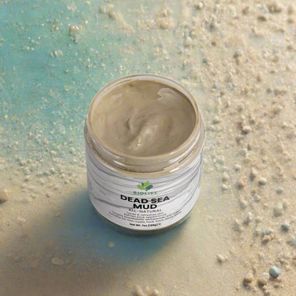 Jar of Dead Sea mud with visible brand label on a white background